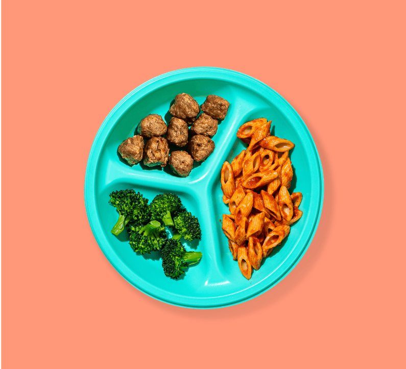 A toddler's hand sits next to a teal-colored plate of chicken nuggets, broccoli and sweet potato bites.