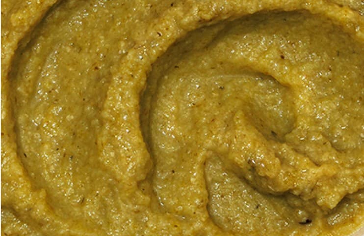 Close up of a Tropical Greens Bowl Babyblend showing the four ingredient combos and thicker textures typical of Stage 4