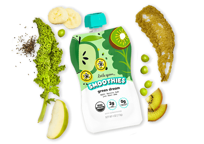 A Little Spoon Smoothies pouch in the flavor 'Green Dream' placed in the center of the image. Around the pouch, the smoothie ingredients are arranged including a fresh green apple slice, kale, kiwi, and banana.