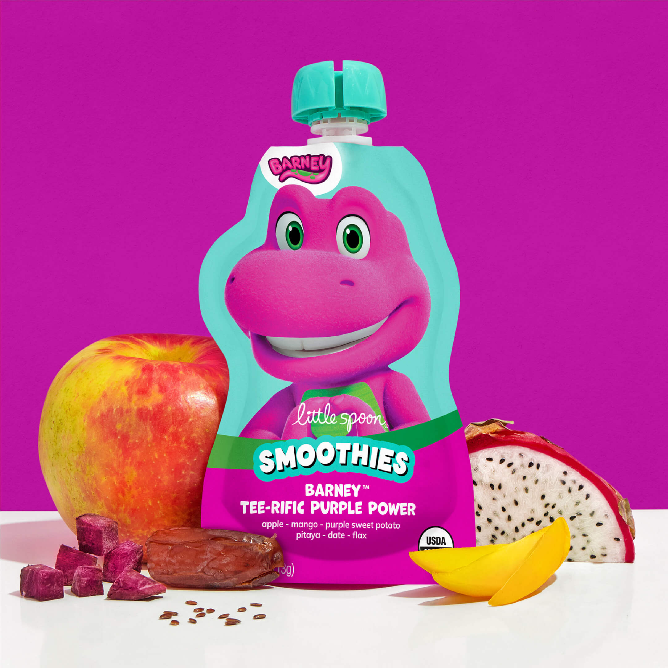 Barney Tee-rific Purple Power Smoothies next to ingredients, apple, pitaya, mango, purple sweet potato and flaxseeds