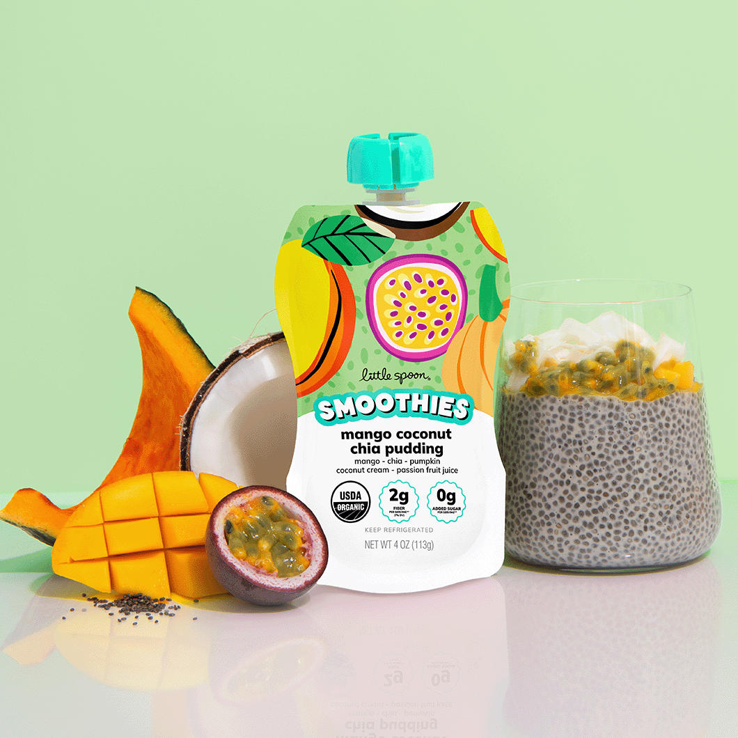 Mango coconut chia pudding smoothie next to mango chia pudding with ingredients from the smoothie on a table