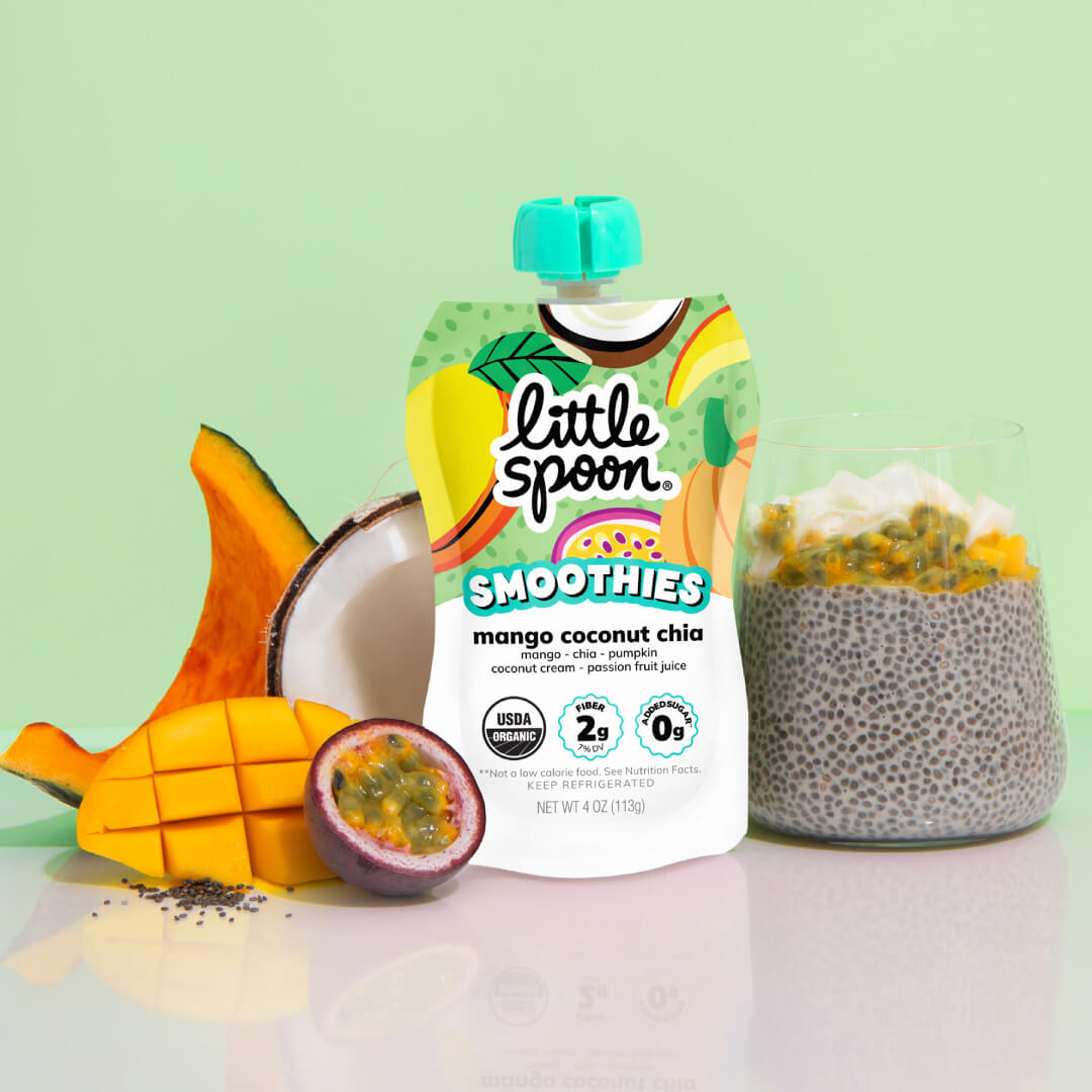 Mango coconut chia smoothie next to mango chia pudding with ingredients from the smoothie on a table