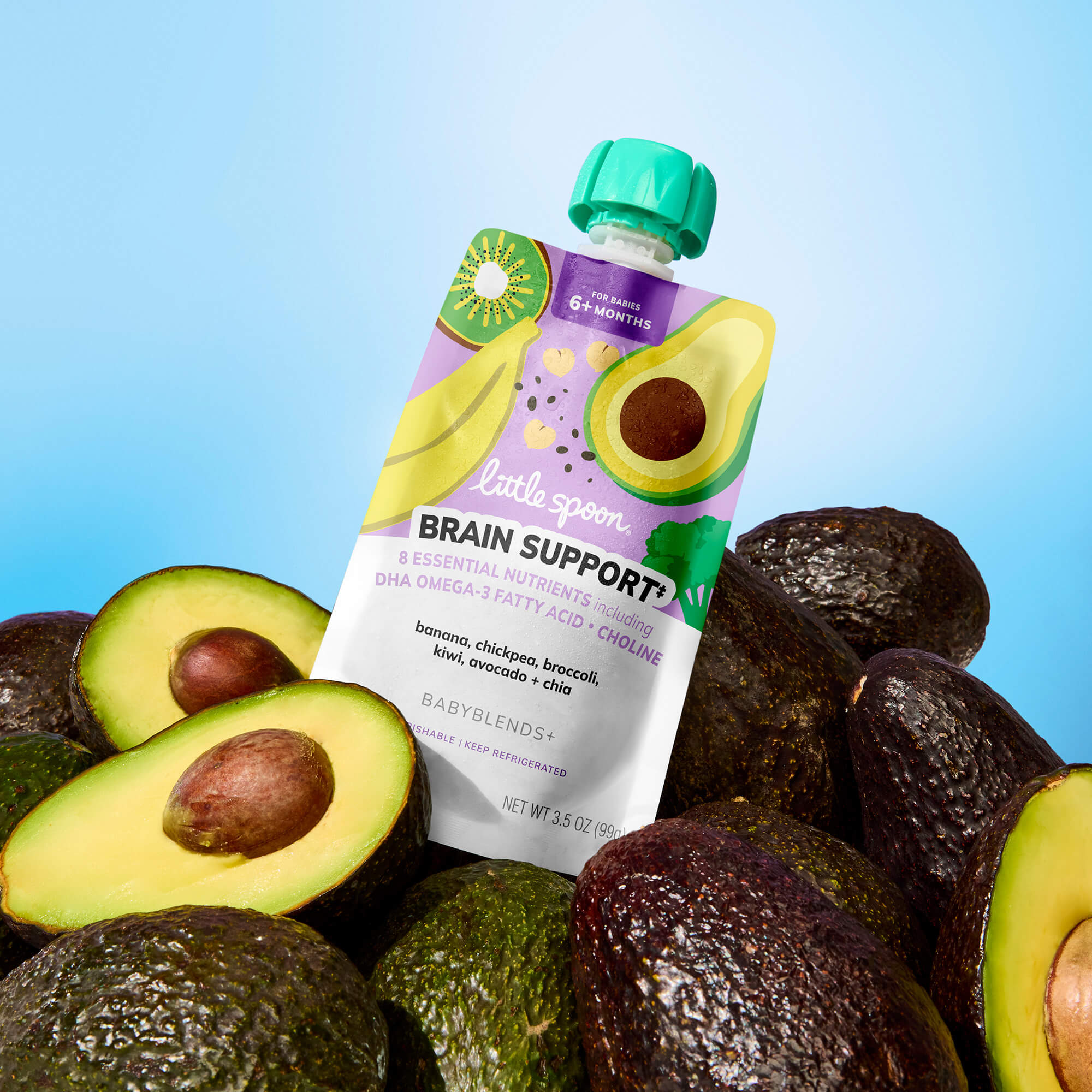 Banana, Chickpea, Broccoli, Kiwi, Avocado + Chia Babyblend+ pouch on top of a pile of avocados