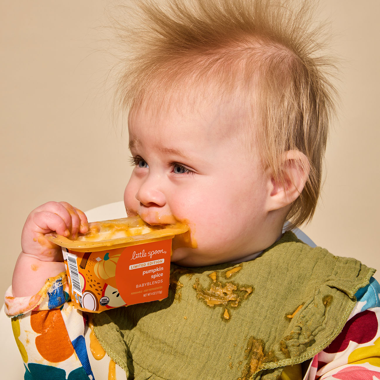 baby holding Limited Edition Pumpkin Spice babyblend cup