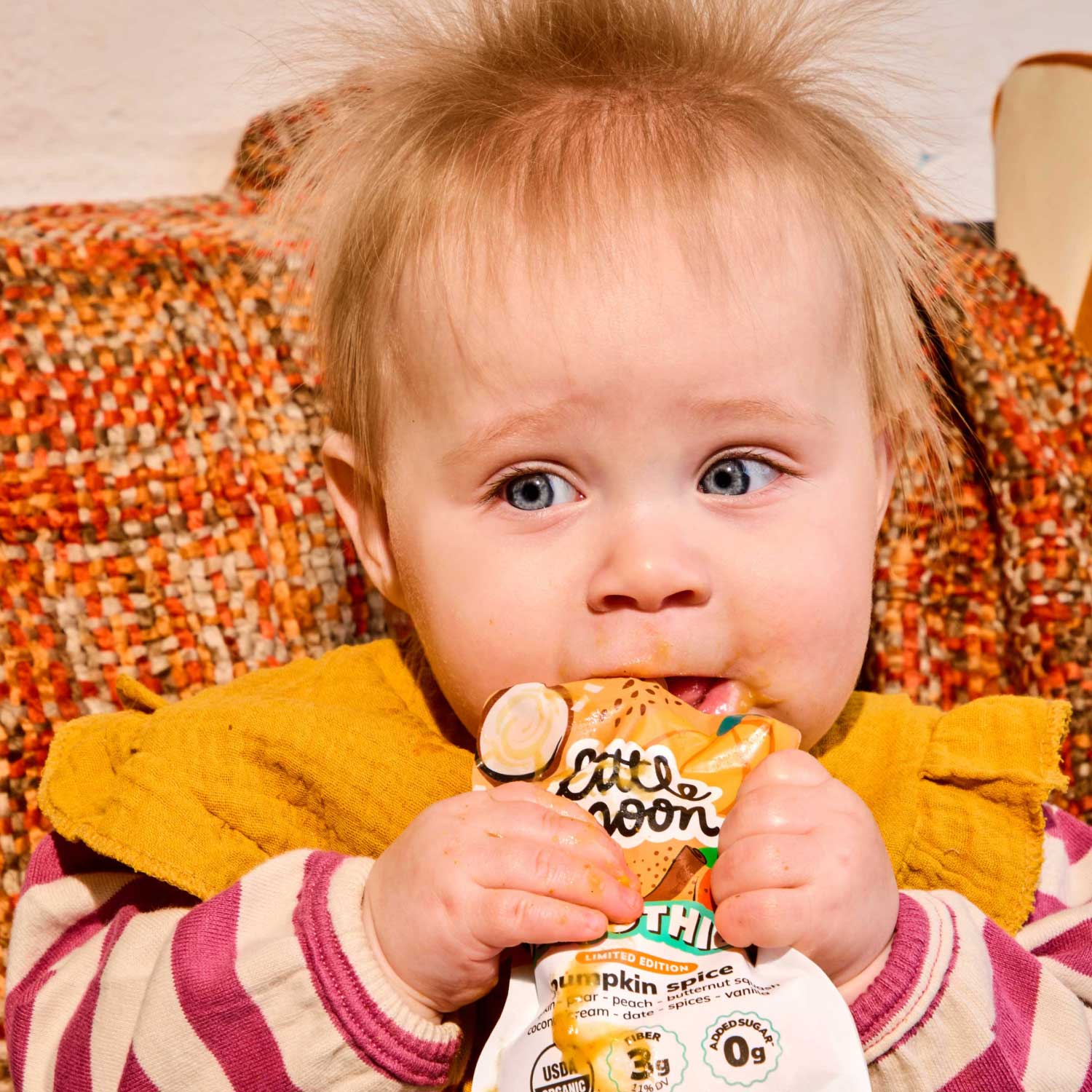 baby drinking a Limited Edition Pumpkin Spice smoothie pouch