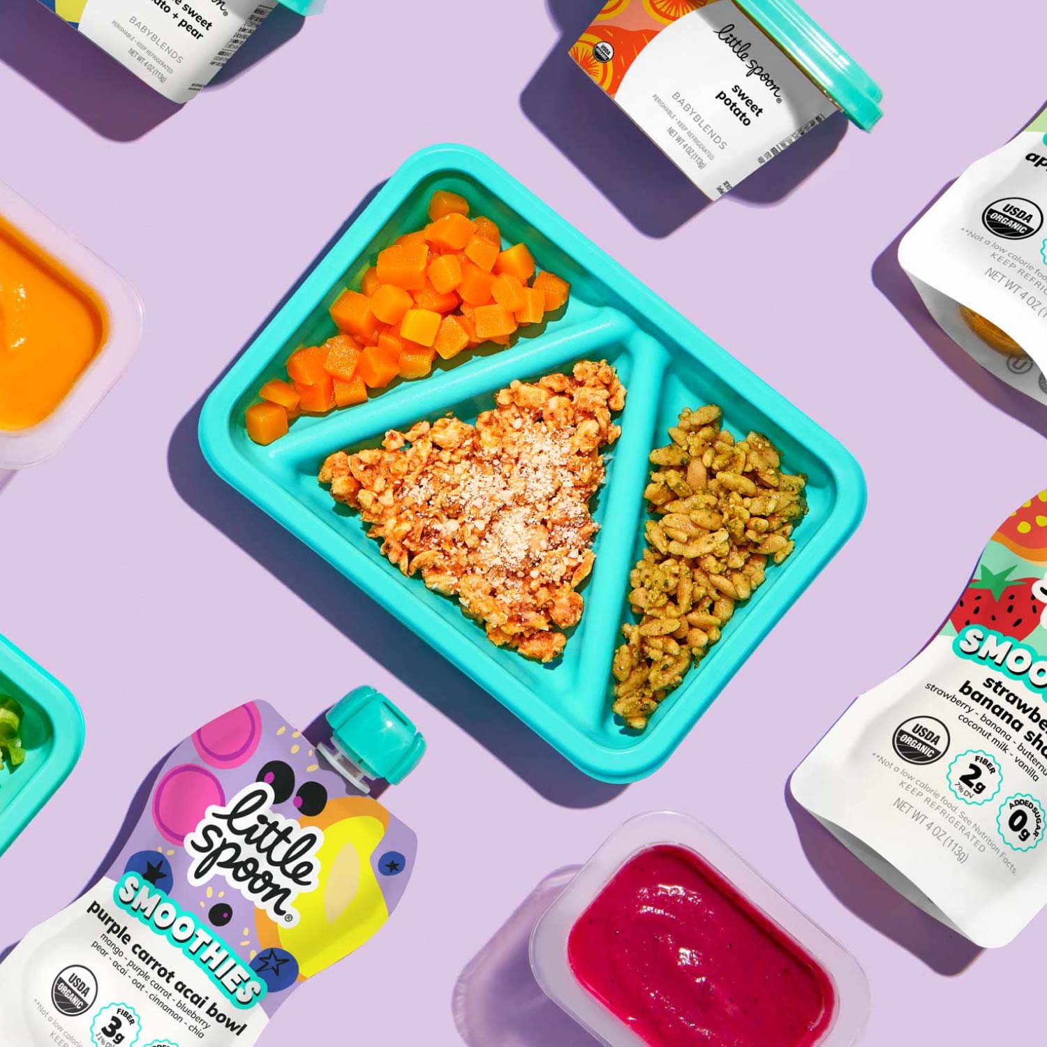 Parmesan Chicken Biteable alongside a variety of babyblend cups and smoothie pouches