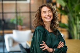A Happy Person standing with folded hands