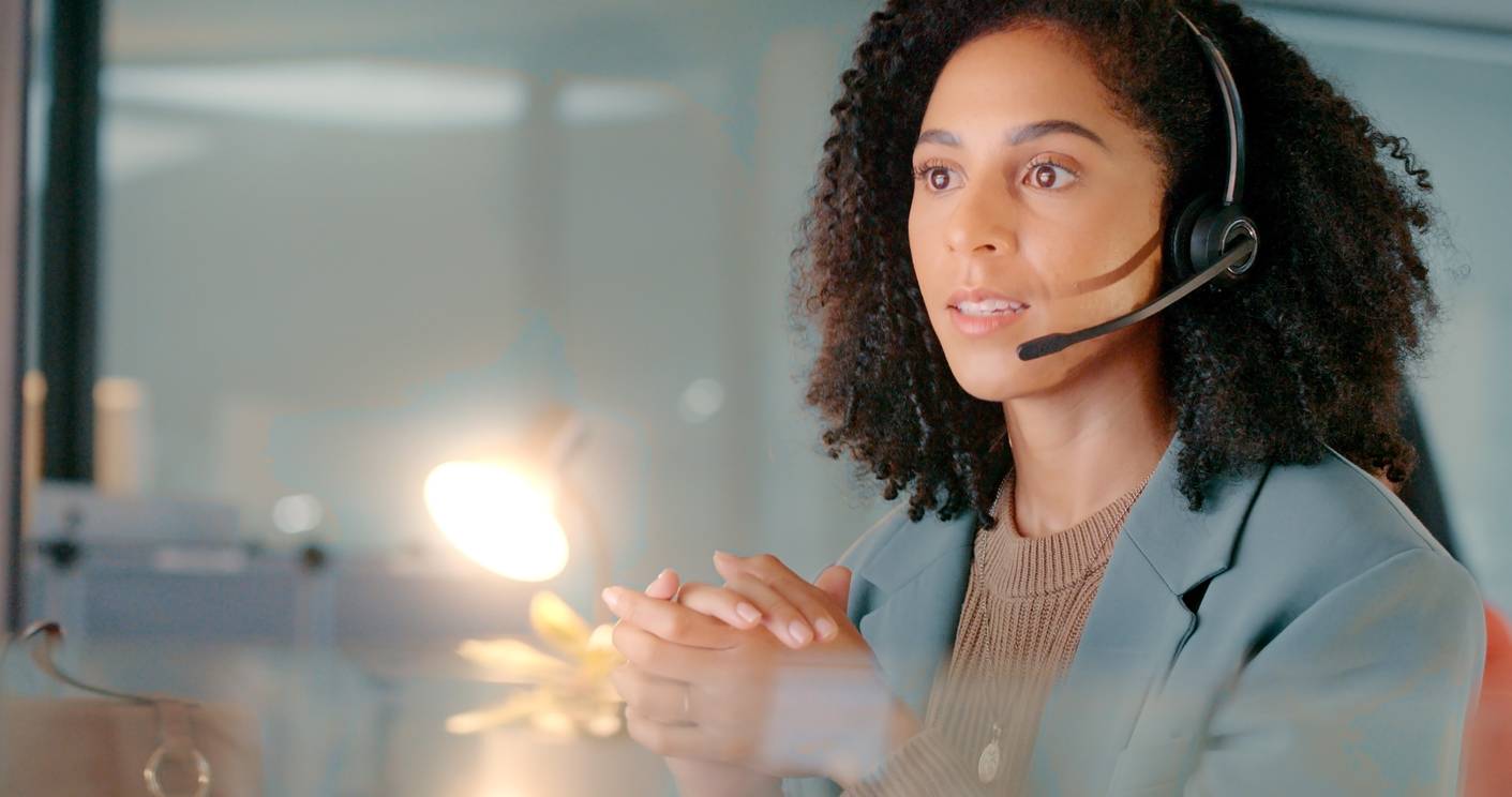 Call center, black woman with crm and working in customer service, consulting with customer, headset and phone call conversation. Contact us, customer support and help on call, online and consultant.