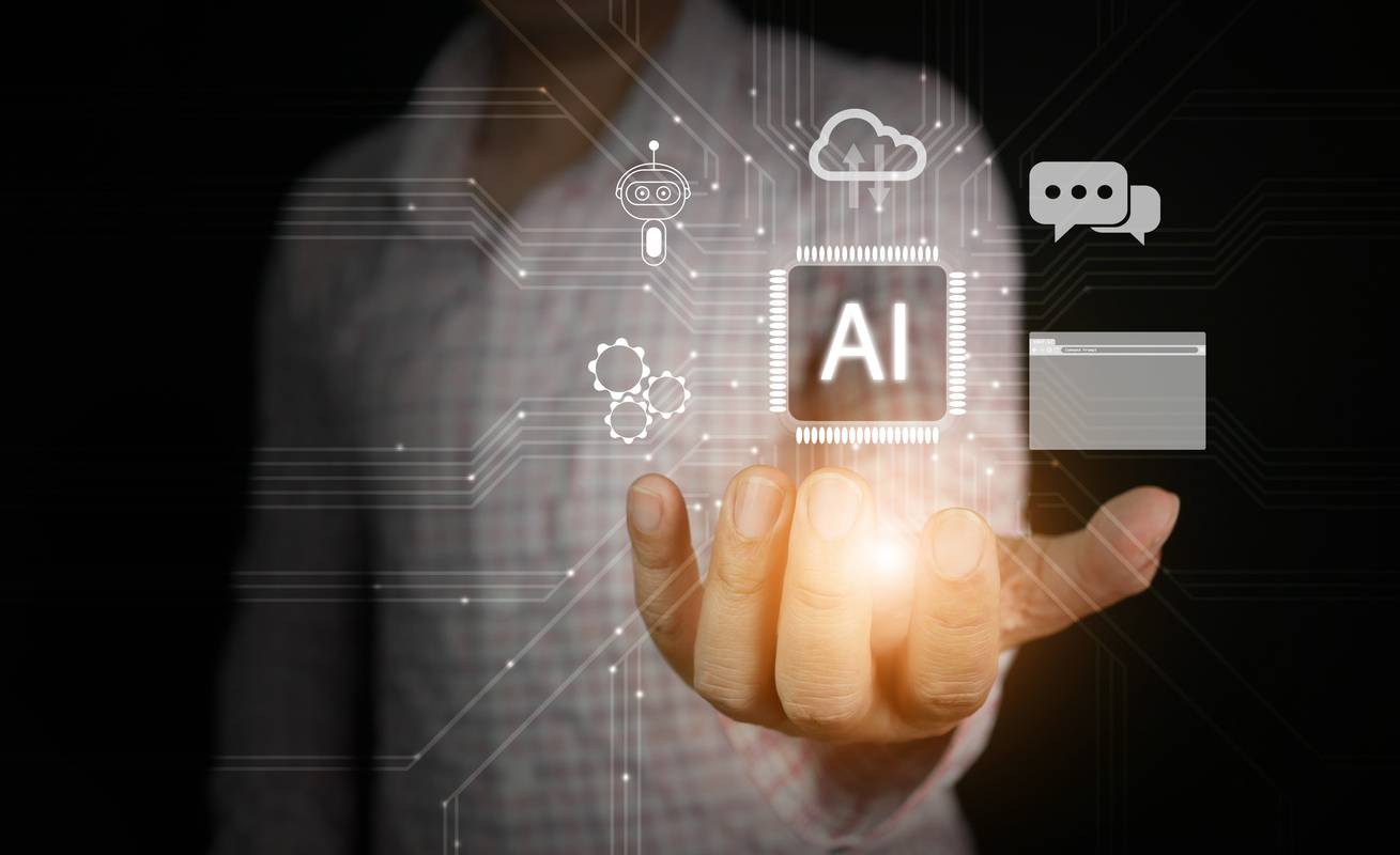 Artificial Intelligence. AI technology. A man uses Ai tech while virtual graphic and circuit connection shown in his hand Artificial Intelligence. AI technology. A man uses Ai tech while virtual graphic and circuit connection shown in his hand