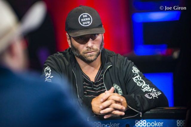 Rick Salomon at the poker table wearing a black cap