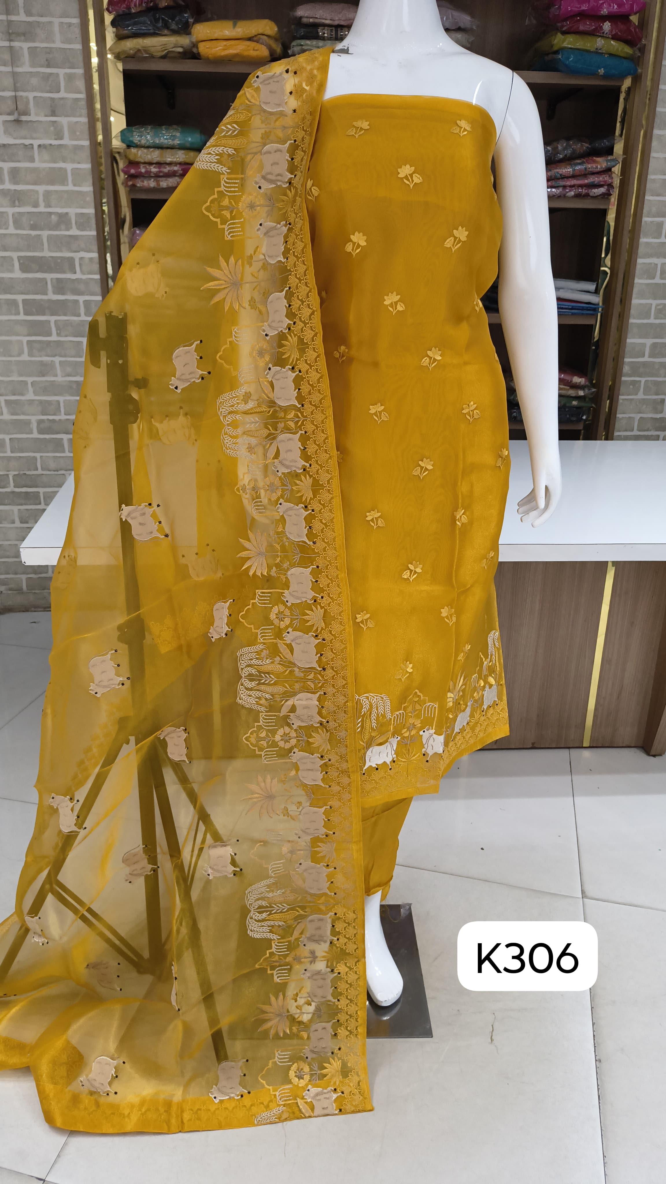 Organza silk party wear suits by Bella fashion