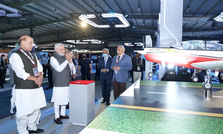 Prime Minister Narendra Modi unveils indigenous trainer aircraft HTT-40, designed & developed by HAL, during DefExpo 2022 1 112 42