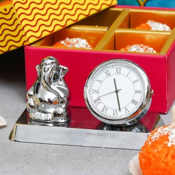 Metal Clock with Ganesha - 4 Ladoo Candles - 100gms each Cashew & Raisin - Image 2