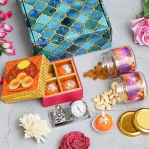 Metal Clock with Ganesha – 4 Ladoo Candles – 100gms each Cashew & Raisin