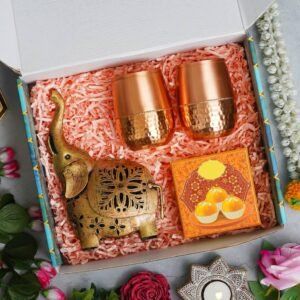 1 Metal Elephant Home Decor (5”*9”) – 2 Copper Glass – 4 Ladoo Candles