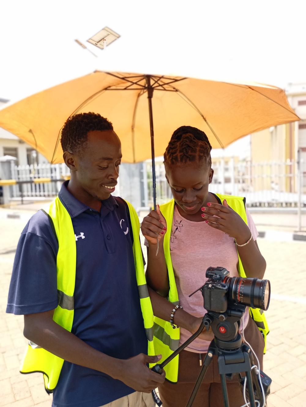 Albright Odhiambo on set, camera in hand