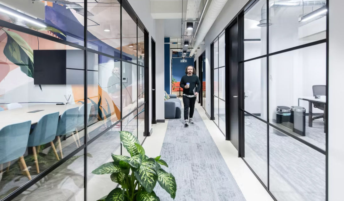 Glass corridor at Runway East London Bridge with view into meeting room