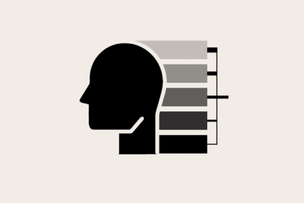 A greyscale icon of a face with a tree-diagram coming out from behind