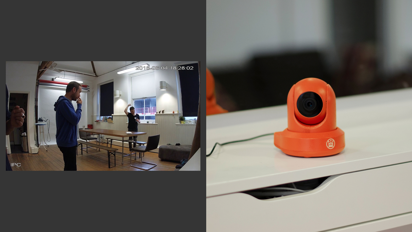 Photo of a bright orange cctv camera