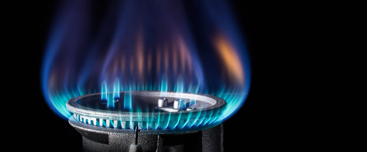 A burning flame on a cooker.