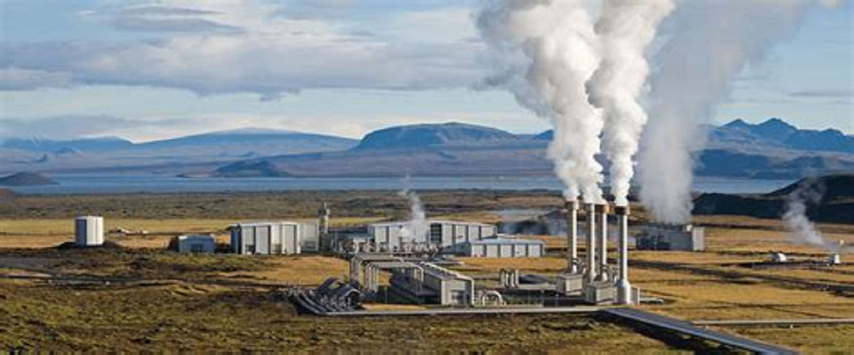 A geothermal energy plant in a field.