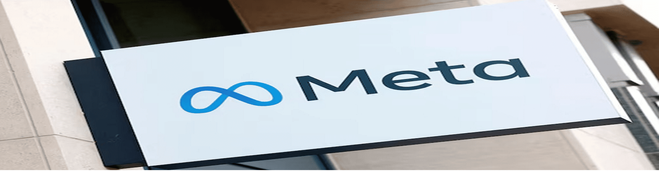 Meta logo in front of a building.