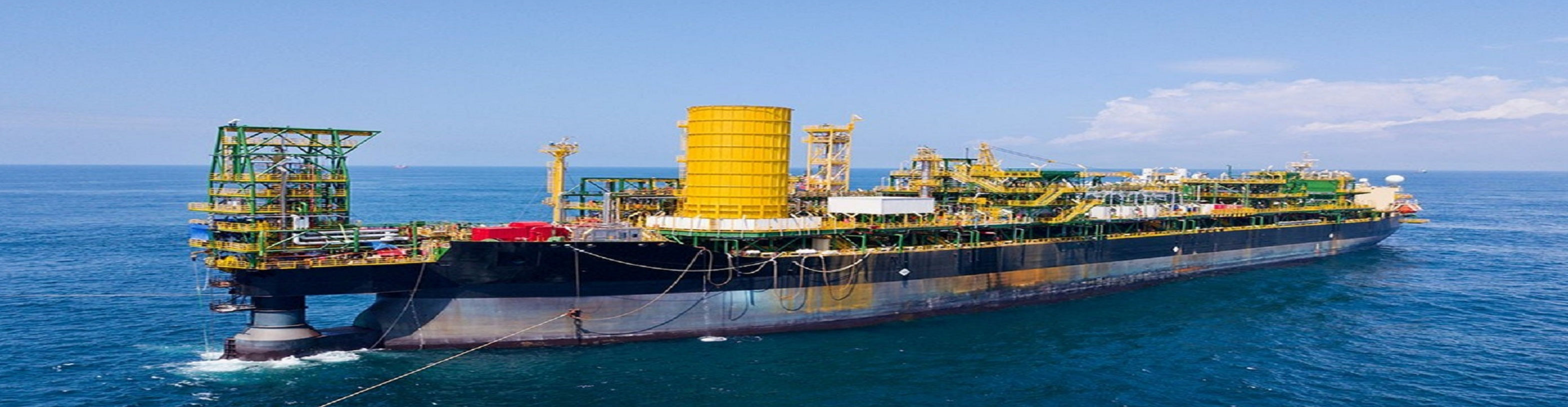 Offshore drill ship on a blue sea.