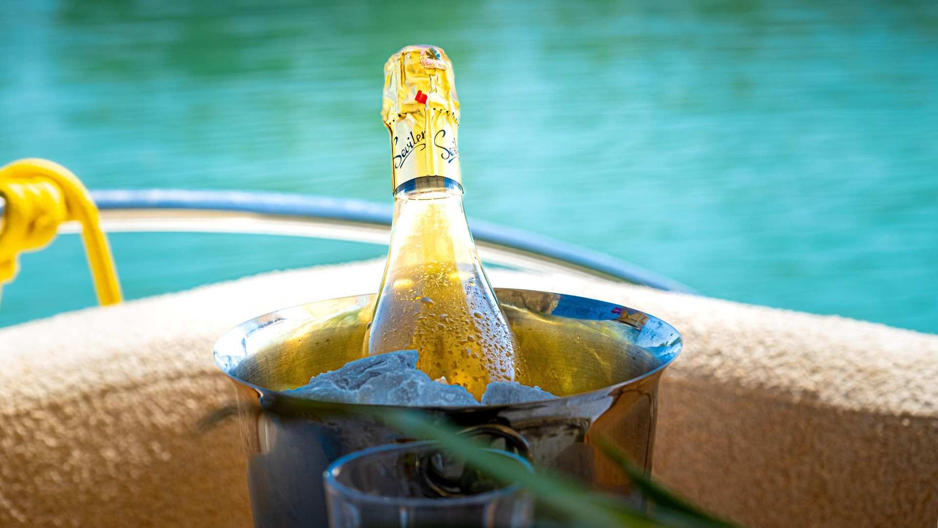 Bottle of champagne chilling in ice bucket on Apollo SS Luxury Yacht deck