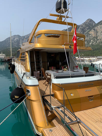 Rear deck of the Regnum Yacht with dining setup and Turkish flag