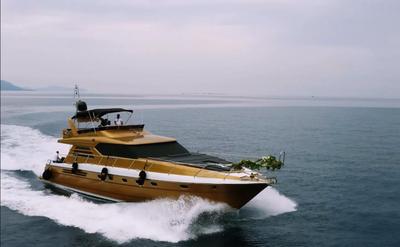 Regnum Yacht cruising on calm sea with floral decoration on bow