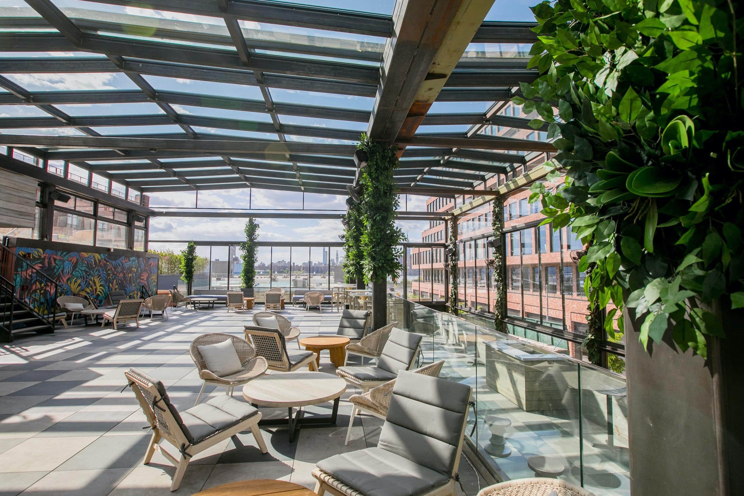 Indoor garden seating area with glass roof