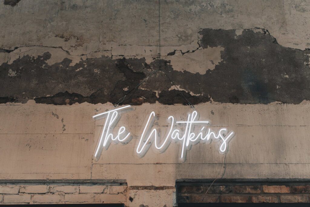 neon sign with wedding couple last name