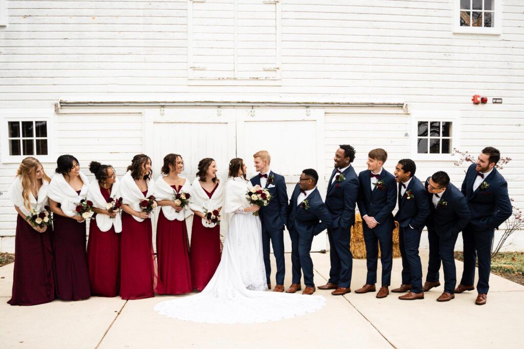 Bridal party lined up with couple in the middle.