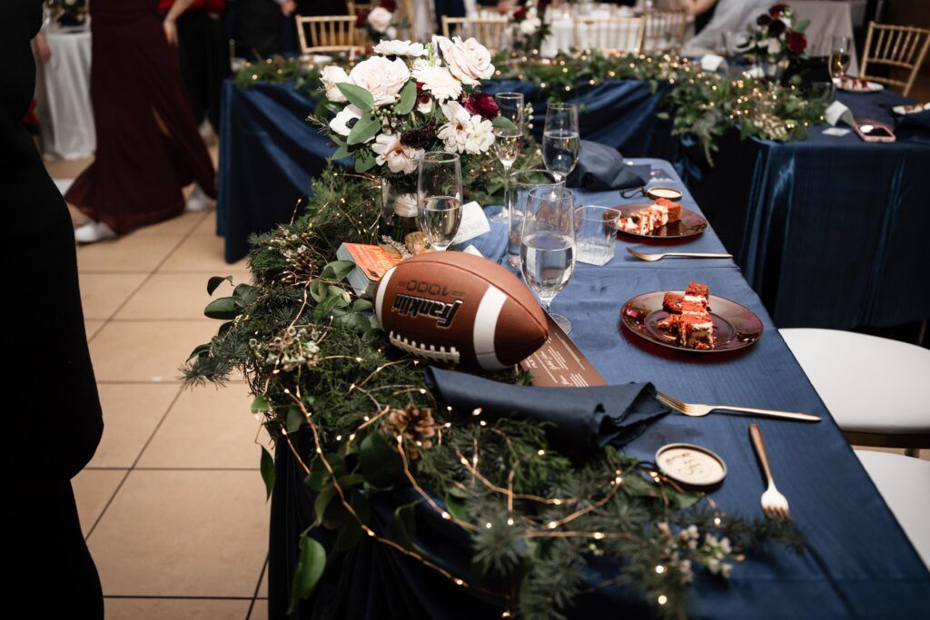 Head table with football in the centerpiece.