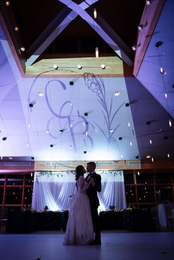 Newlyweds last dance, custom lighting with their monogram.