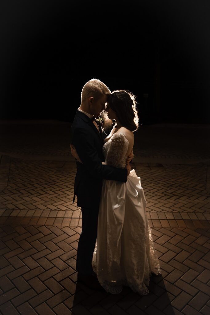 Newlyweds embracing in a private moment.