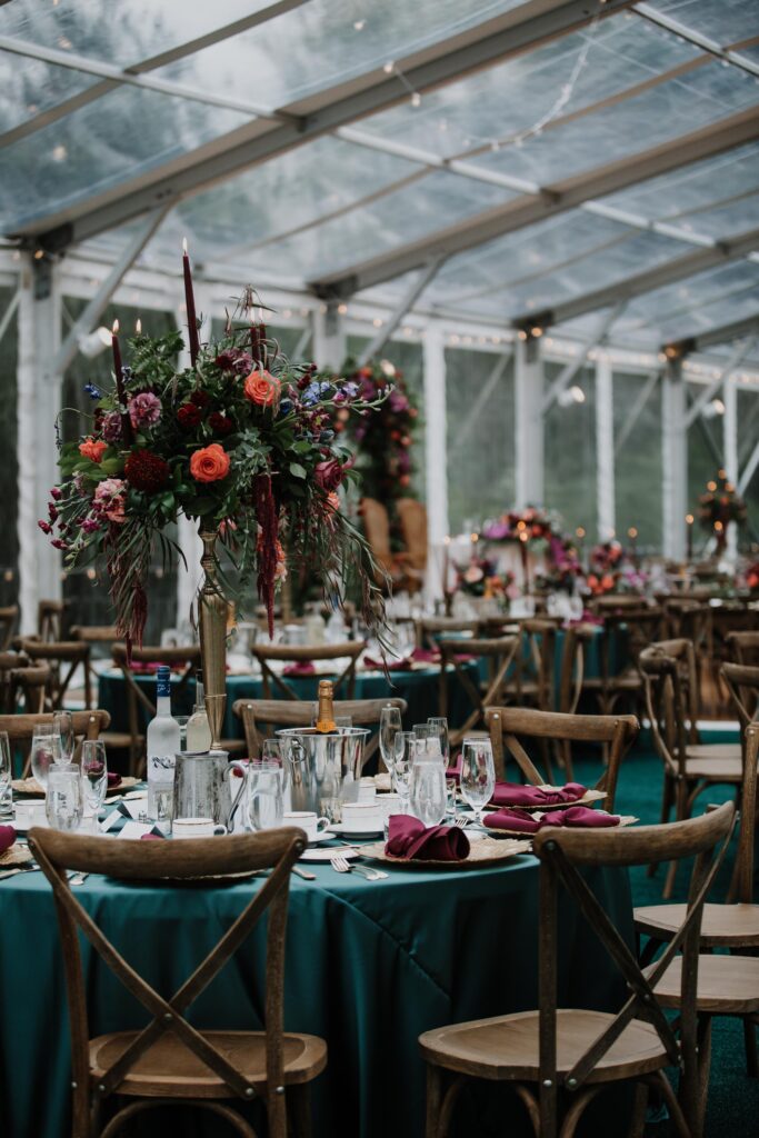 Table and tall floral centerpiece.
