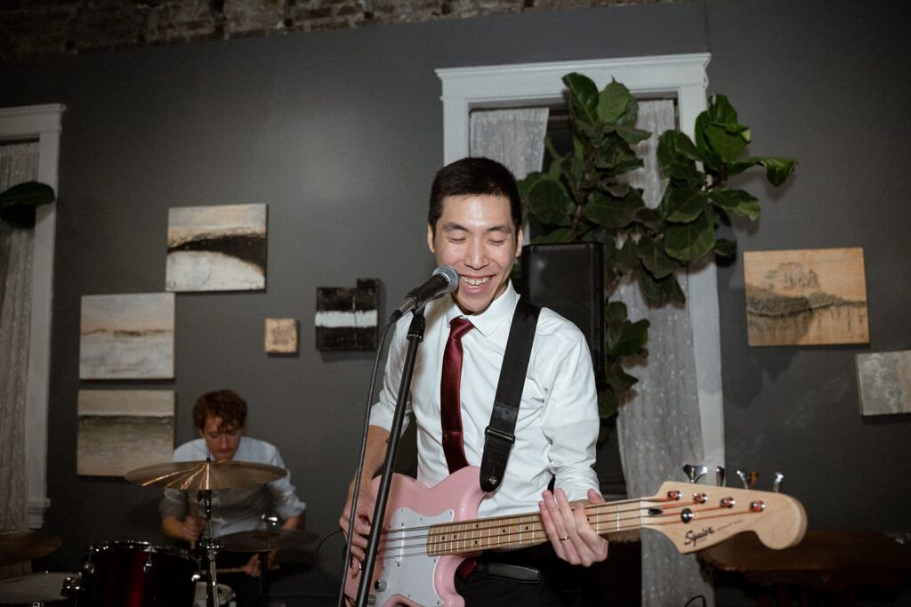 groom singing with guitar