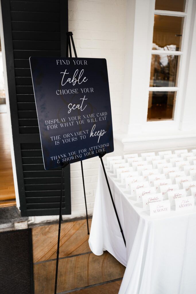 Entrance sign and table names.
