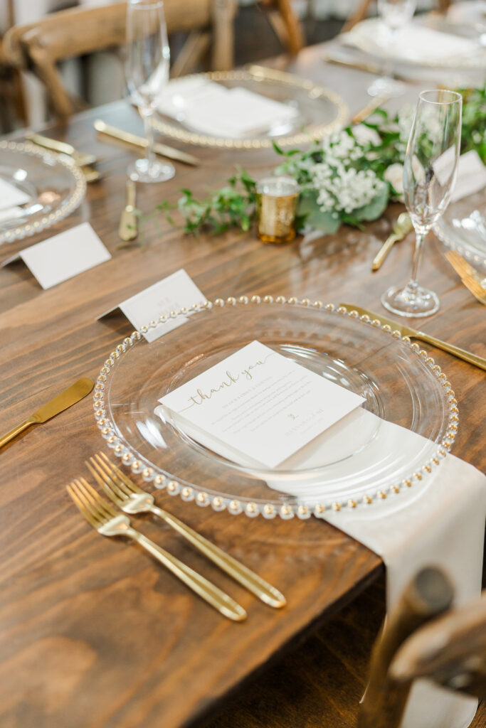 reception place setting with gold accents