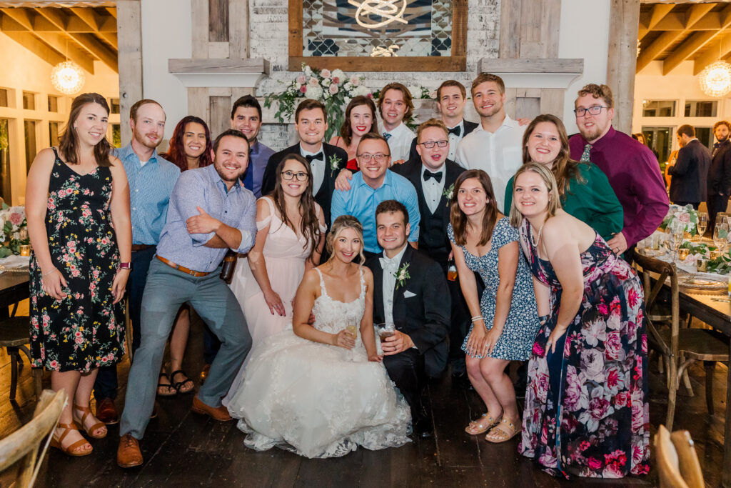 family gathering for photo on wedding day