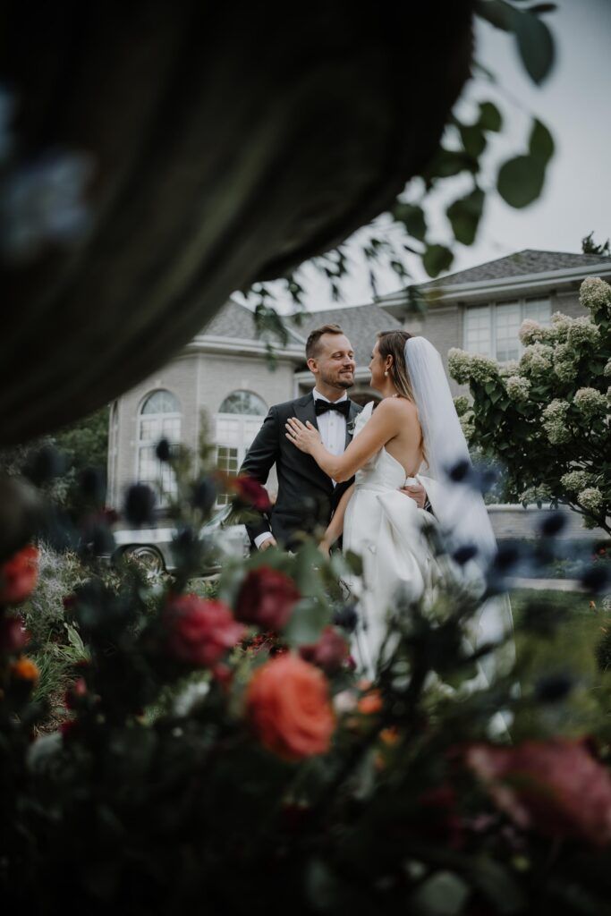 Newlyweds embrace.