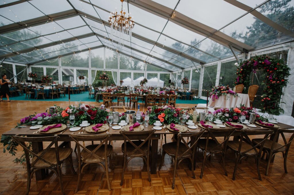 Room view of the clear tent and reception tables.