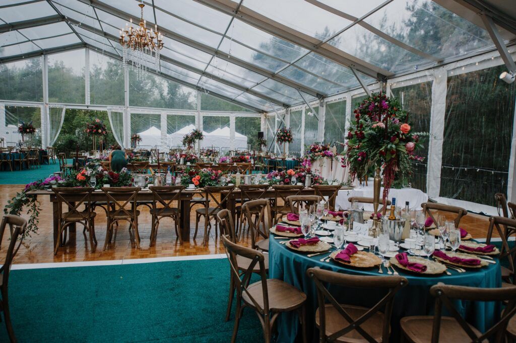 Room view of the clear tent and reception tables.
