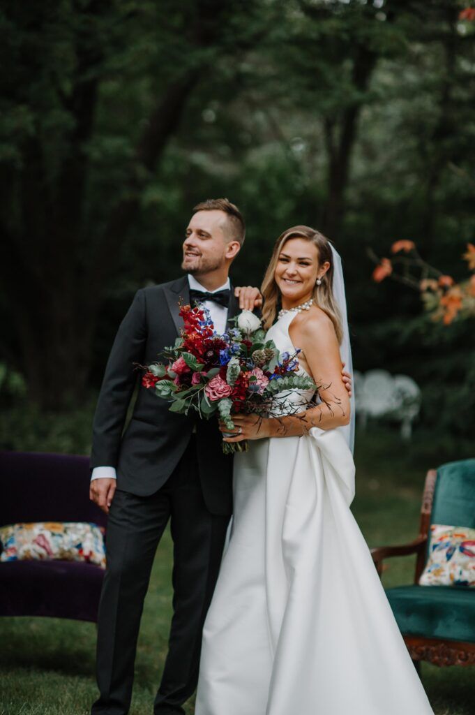 Couple, bride holding bouquet.