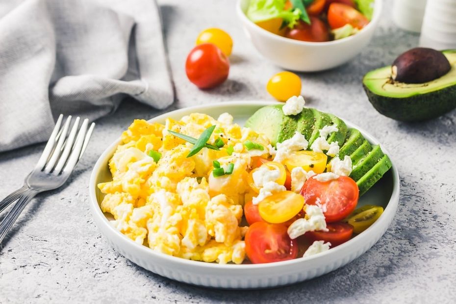 Scrambled eggs with a side of avocado and other healthy breakfast foods