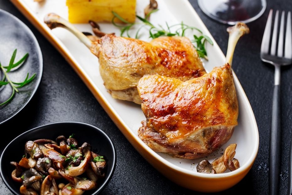 Duck confit and mushrooms on a platter