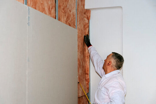 Wall insulation installation work in Denver