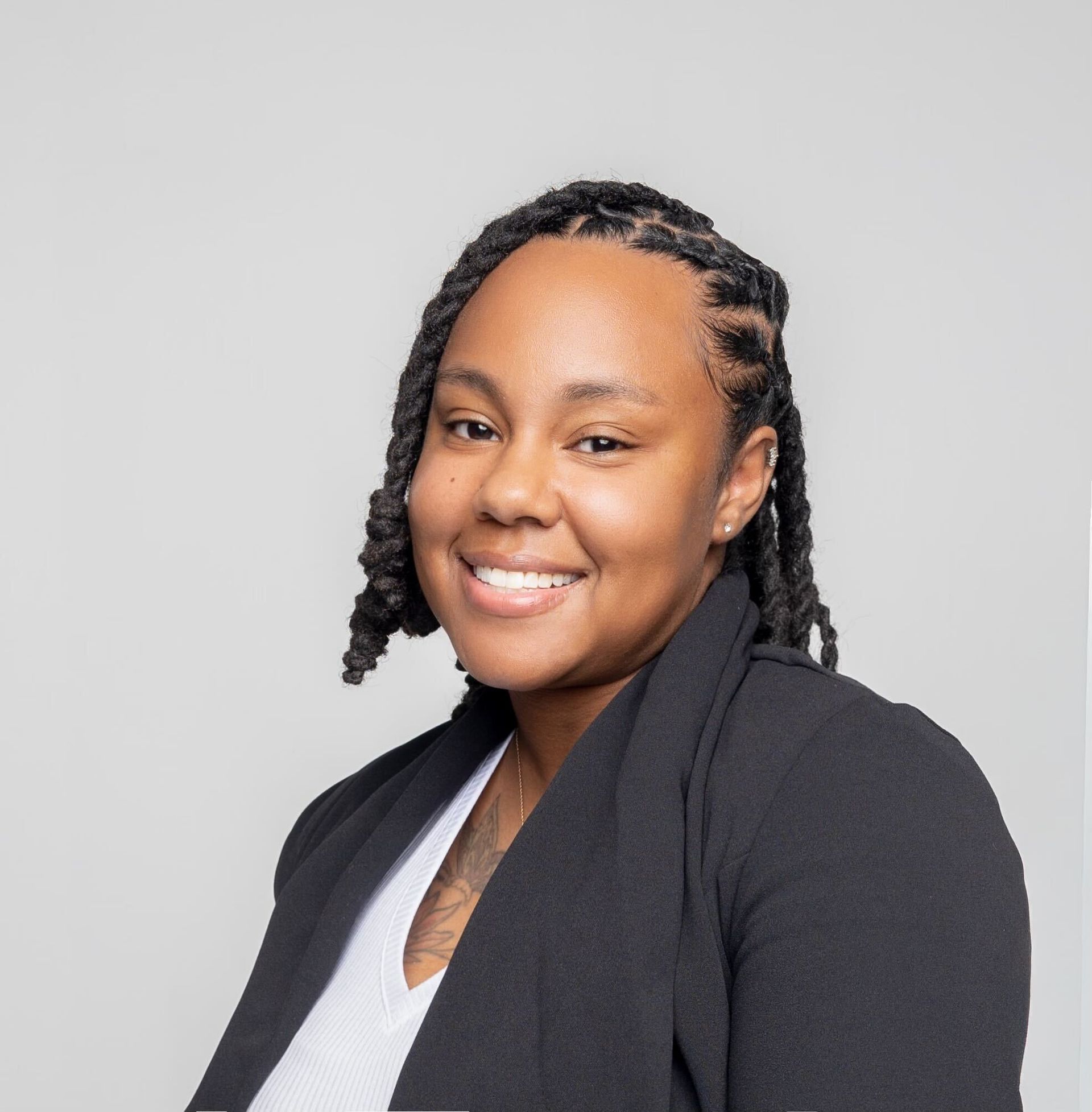 Headshot of Mae Care Coordinator Angelica, gray background.