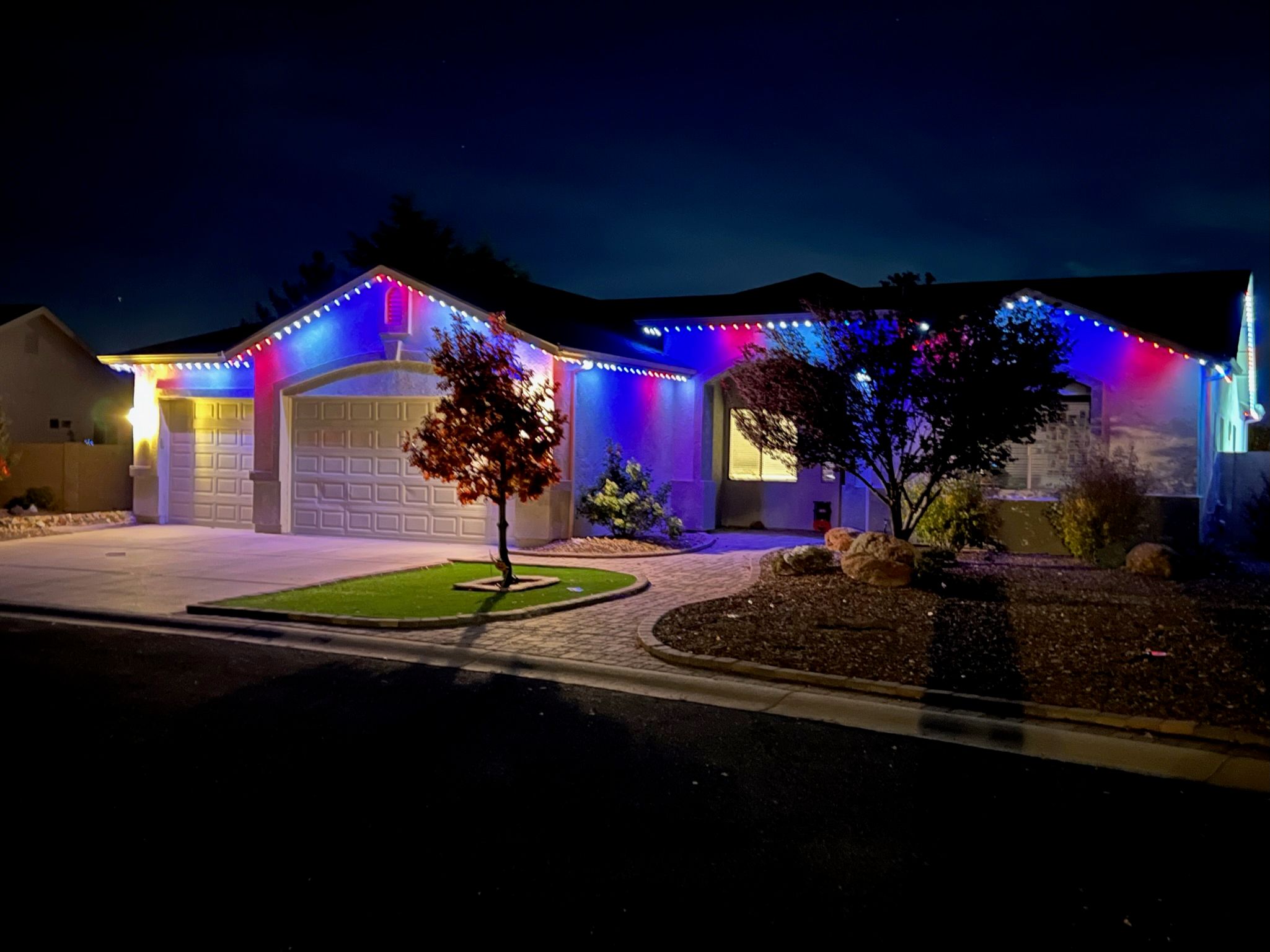 Elegant permanent LED light installation along home roofline by Glow Daddy
